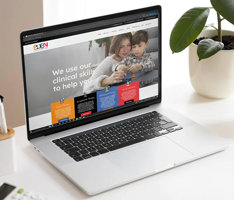 Showing the website of Eden Child Development on laptop created by the best branding agency in Calicut