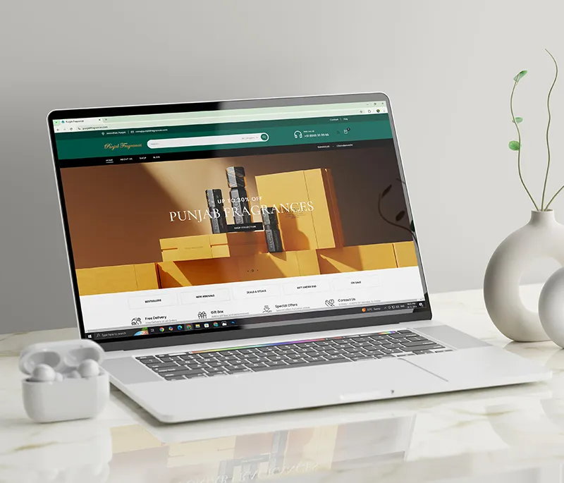 Showing the website of Punjab Fragrance on a laptop created by the branding agency in Calicut