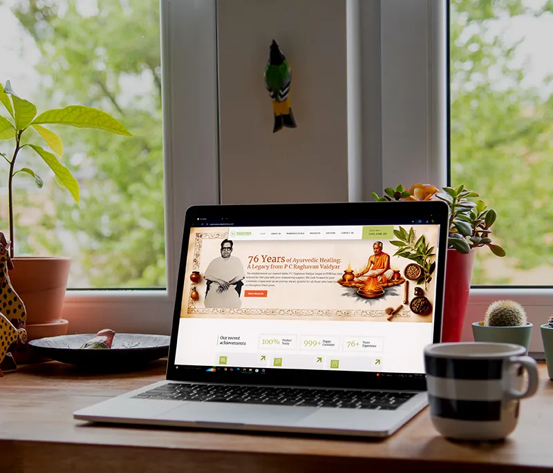 Showing the website home page of Raghava Pharmacy on a laptop created by best branding agency in Calicut